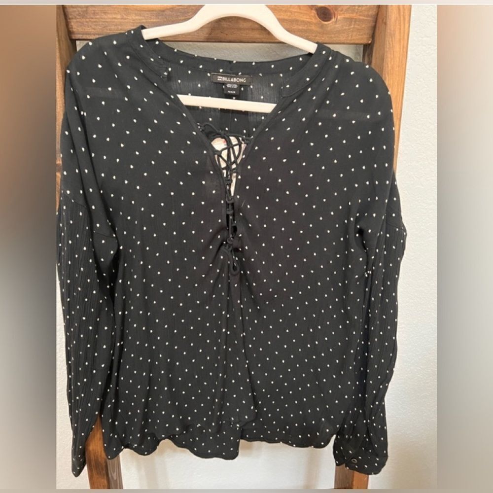 Billabong top, black with white dots, size medium, laces up at chest